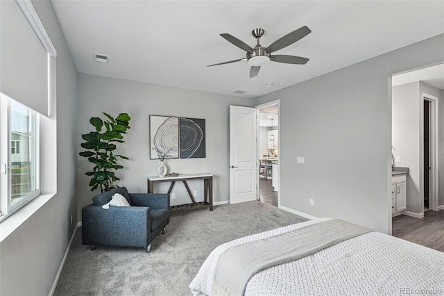 1592 Maggie Mae Ln, Castle Rock, CO 80104 - carpeted bedroom featuring baseboards, ceiling fan, and ensuite bathroom