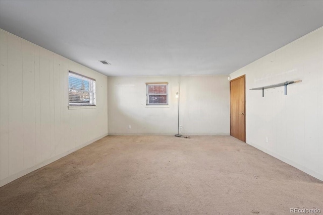 spare room with light colored carpet