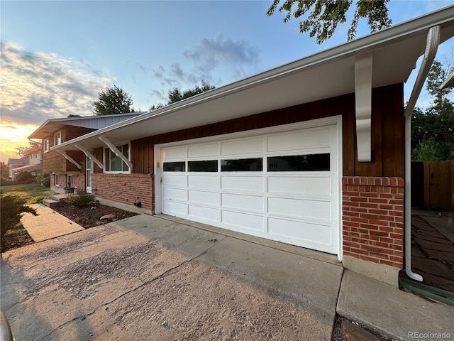 property exterior at dusk with a garage