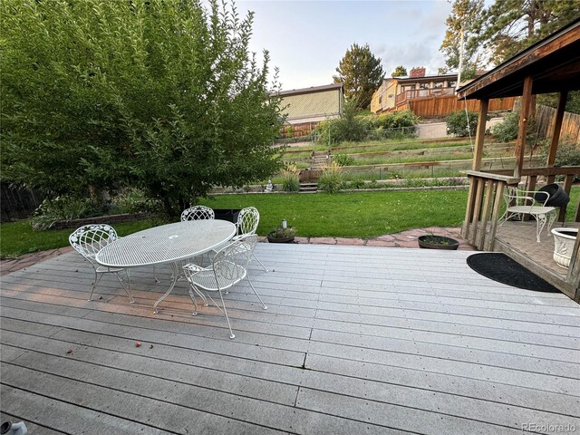 deck featuring a yard