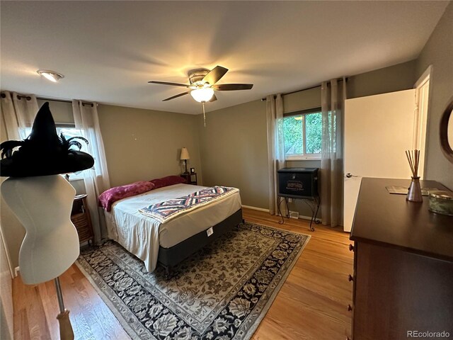 bedroom featuring wood-type flooring and ceiling fan