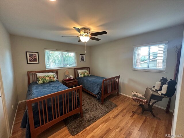 bedroom featuring light hardwood / wood-style flooring and ceiling fan