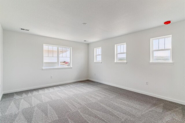 25254 E Warren Pl, Aurora, CO 80018 - carpeted spare room featuring baseboards