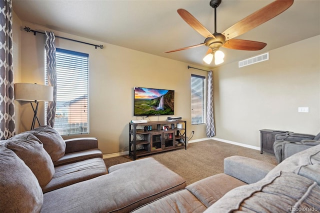 12766 Sunlight Peak Pl, Peyton, CO 80831 - living area featuring carpet, a ceiling fan, and baseboards