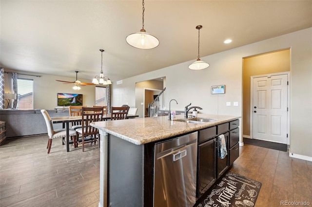 12766 Sunlight Peak Pl, Peyton, CO 80831 - kitchen with stainless steel dishwasher, a sink, dark wood-style flooring, a ceiling fan, and hanging light fixtures