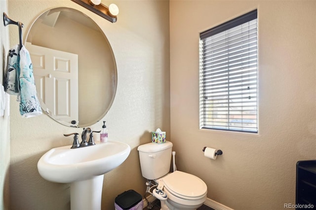 12766 Sunlight Peak Pl, Peyton, CO 80831 - bathroom with toilet and baseboards