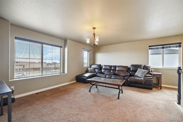 12766 Sunlight Peak Pl, Peyton, CO 80831 - living room with a chandelier, carpet, and baseboards