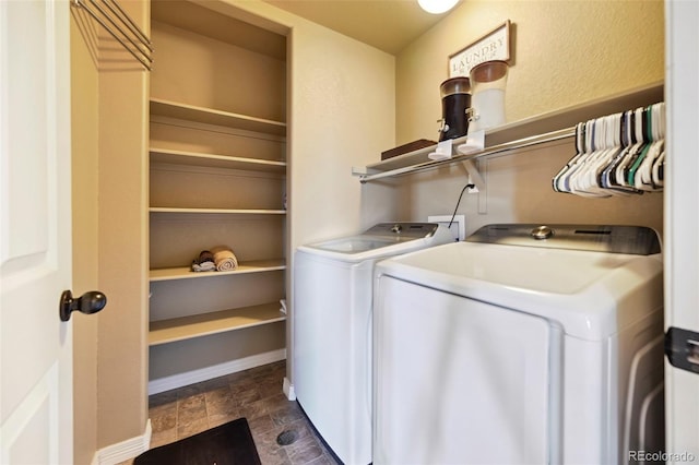 12766 Sunlight Peak Pl, Peyton, CO 80831 - washroom with separate washer and dryer, stone finish flooring, and baseboards