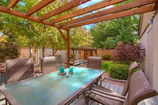 3835 Pecos St, Denver, CO 80211 - fenced backyard featuring outdoor dining area and a pergola