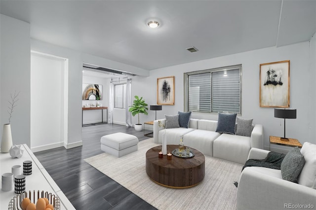 living room featuring dark hardwood / wood-style floors