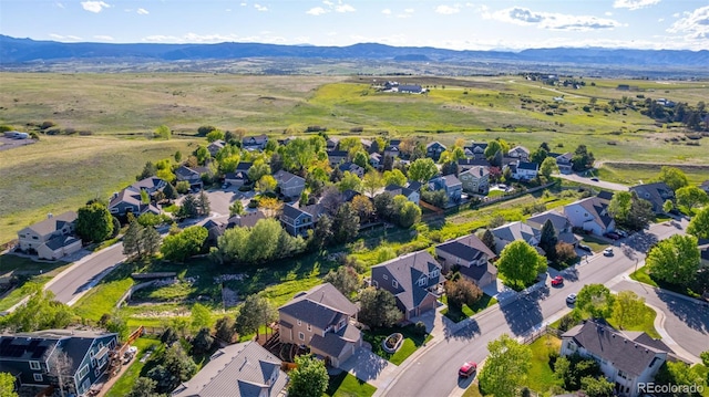5048 Rocky Mountain Dr, Castle Rock, CO 80109 - aerial view of property and surrounding area featuring nearby suburban area and a mountain backdrop