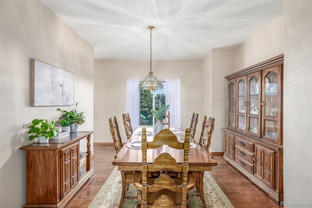 5048 Rocky Mountain Dr, Castle Rock, CO 80109 - dining area featuring a chandelier, wood finished floors, and baseboards