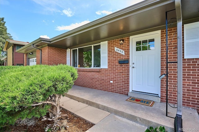 8490 E Davies Pl, Centennial, CO 80112 - doorway to property with brick siding
