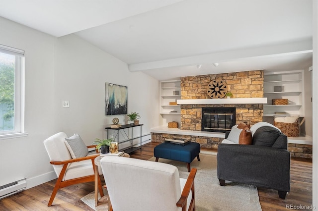 8490 E Davies Pl, Centennial, CO 80112 - living area featuring baseboard heating, wood finished floors, a fireplace, and a baseboard radiator