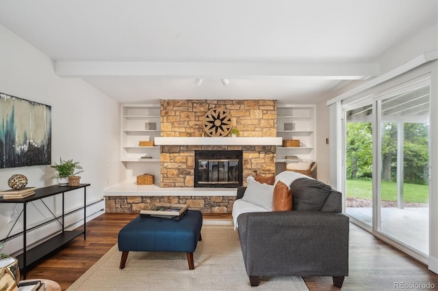 8490 E Davies Pl, Centennial, CO 80112 - living area with wood finished floors, a baseboard radiator, a fireplace, built in shelves, and beam ceiling