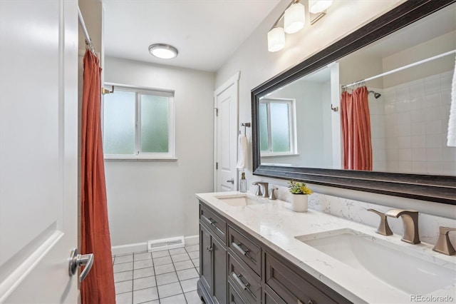 8490 E Davies Pl, Centennial, CO 80112 - full bath with tile patterned flooring, double vanity, and curtained shower
