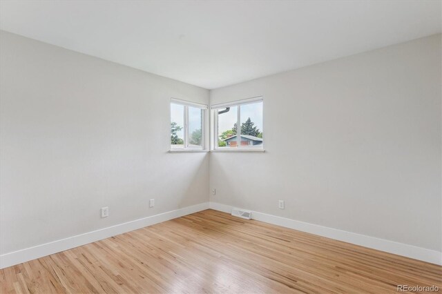 8490 E Davies Pl, Centennial, CO 80112 - unfurnished room featuring baseboards and light wood-style flooring