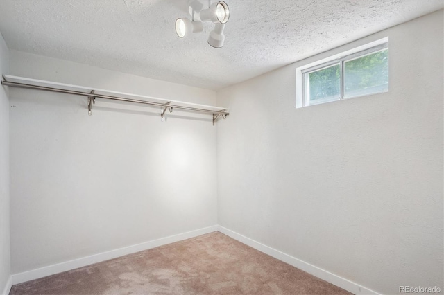 8490 E Davies Pl, Centennial, CO 80112 - spacious closet featuring carpet flooring and a chandelier