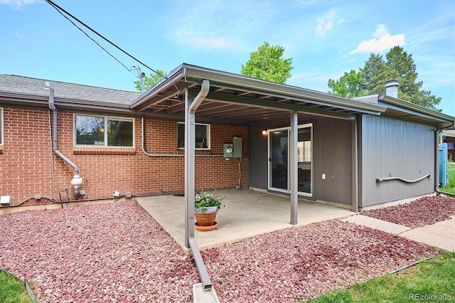 8490 E Davies Pl, Centennial, CO 80112 - back of property with a patio and brick siding
