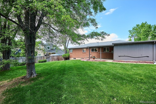 8490 E Davies Pl, Centennial, CO 80112 - rear view of property featuring brick siding and a patio