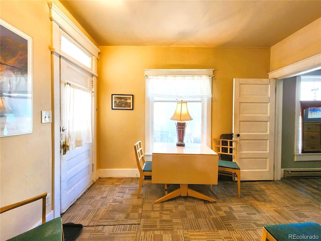 dining area with baseboard heating, baseboards, and carpet floors