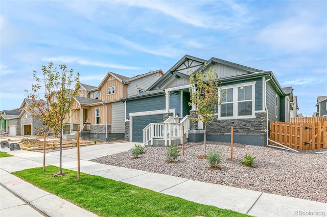 13342 E 110th Way, Commerce City, CO 80022 - craftsman inspired home with stone siding, a residential view, concrete driveway, and board and batten siding