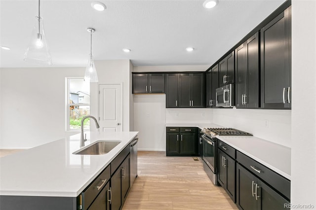 13342 E 110th Way, Commerce City, CO 80022 - kitchen featuring a sink, stainless steel appliances, light wood-style flooring, light countertops, and recessed lighting