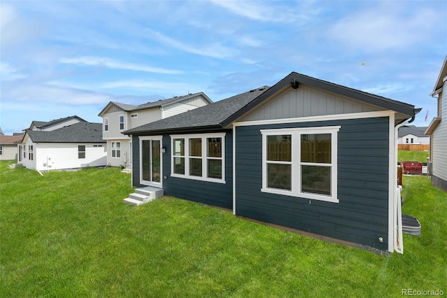 13342 E 110th Way, Commerce City, CO 80022 - rear view of house featuring a yard, entry steps, and roof with shingles