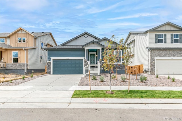 13342 E 110th Way, Commerce City, CO 80022 - craftsman-style home featuring stone siding, concrete driveway, a garage, and board and batten siding