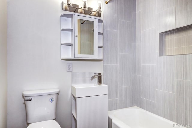 bathroom featuring vanity, toilet, and shower / bathtub combination