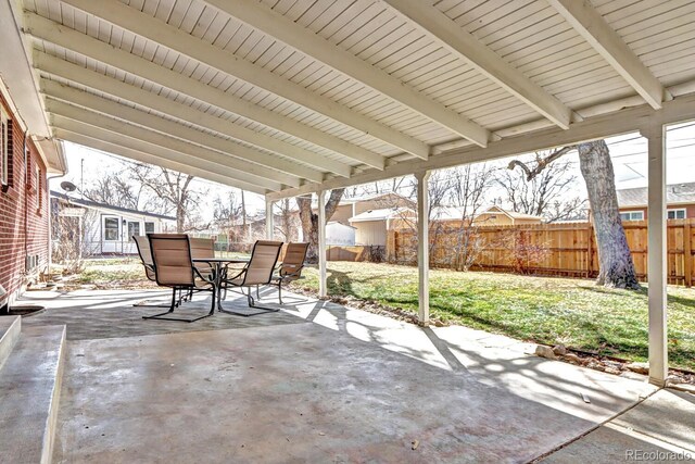 view of patio featuring a fenced backyard and outdoor dining space