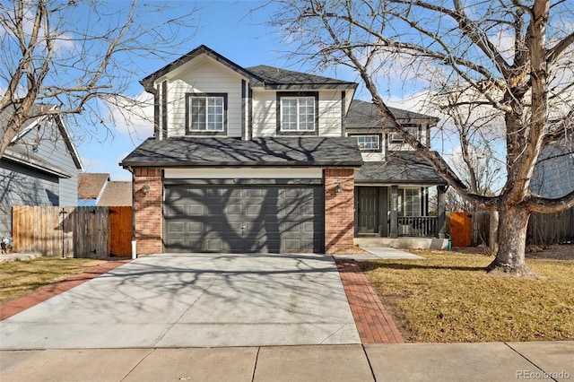 view of front property featuring a front yard and a garage