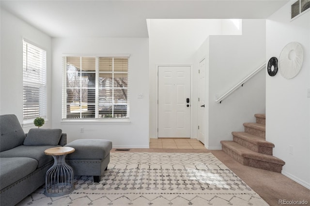 view of carpeted entrance foyer