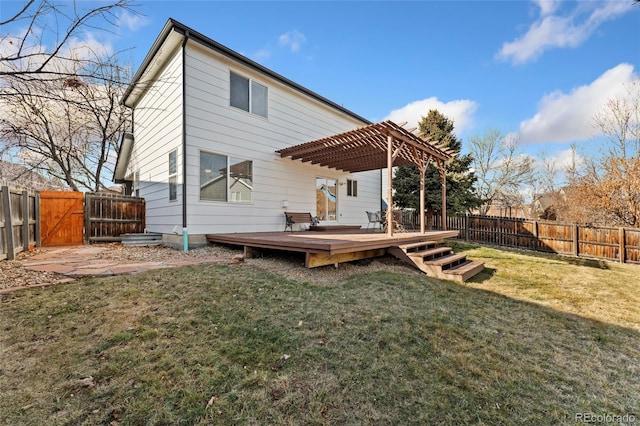 rear view of property featuring a pergola, a yard, and a wooden deck