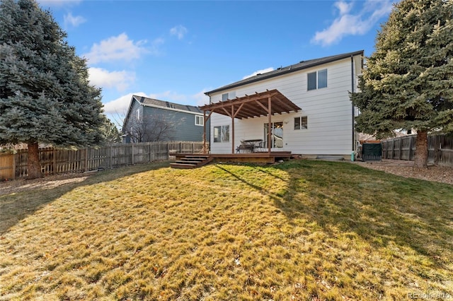 back of property featuring a yard, a pergola, and a wooden deck