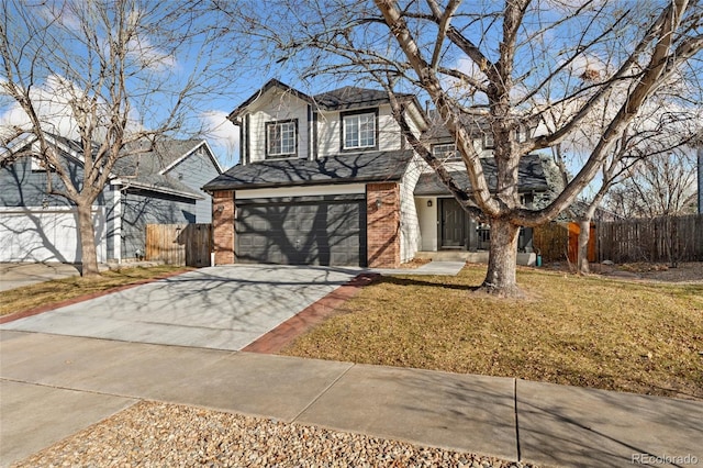 view of property featuring a front yard and a garage