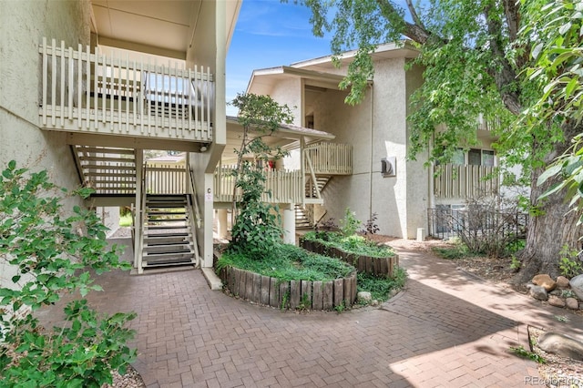 2707 Valmont Rd Unit 106, Boulder, CO 80304 - doorway to property with stucco siding