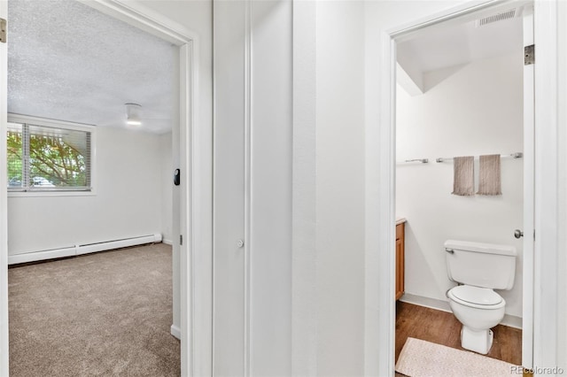 2707 Valmont Rd Unit 106, Boulder, CO 80304 - hall featuring baseboard heating and a textured ceiling