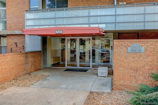 property entrance featuring french doors