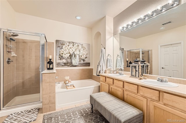 bathroom featuring vanity, tile patterned floors, and independent shower and bath