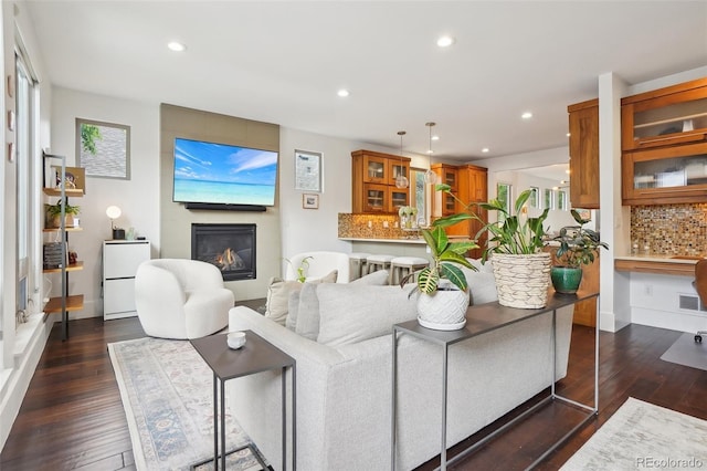 1511 S Pennsylvania St, Denver, CO 80210 - living area with a large fireplace, recessed lighting, and dark wood-style floors