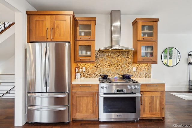 1511 S Pennsylvania St, Denver, CO 80210 - kitchen with appliances with stainless steel finishes, wall chimney exhaust hood, brown cabinets, decorative backsplash, and light countertops