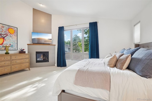 1511 S Pennsylvania St, Denver, CO 80210 - carpeted bedroom with lofted ceiling, a tiled fireplace, and multiple windows