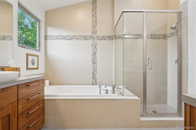 1511 S Pennsylvania St, Denver, CO 80210 - full bathroom featuring vanity, a shower stall, and a garden tub