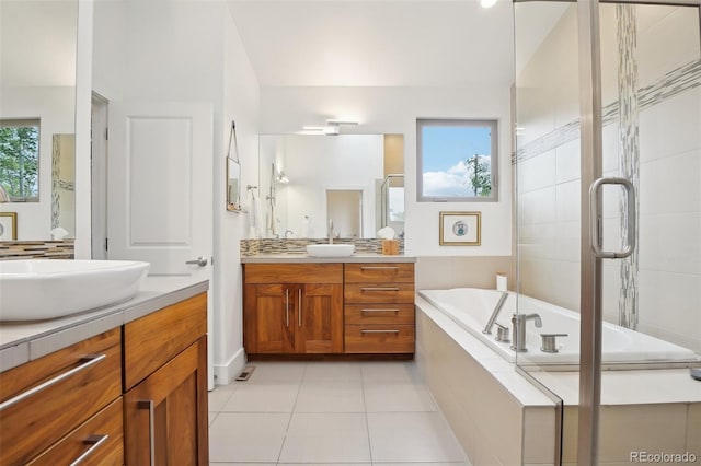 1511 S Pennsylvania St, Denver, CO 80210 - bathroom with vanity, a garden tub, tiled shower, and tile patterned flooring
