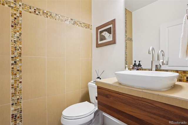 1511 S Pennsylvania St, Denver, CO 80210 - bathroom with vanity, toilet, and tile walls
