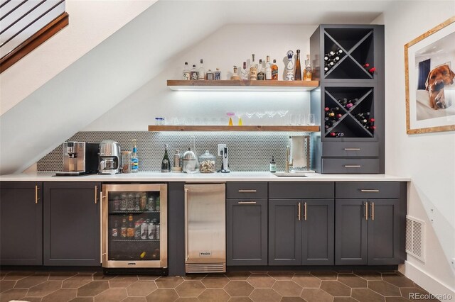 1511 S Pennsylvania St, Denver, CO 80210 - indoor wet bar featuring beverage cooler, decorative backsplash, designer fridge, and dark tile patterned floors