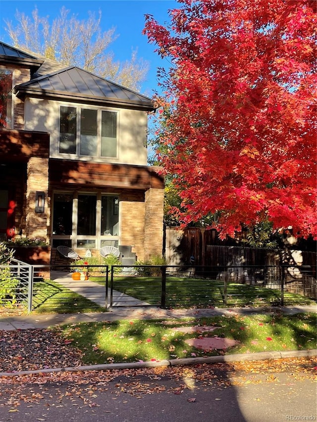 1511 S Pennsylvania St, Denver, CO 80210 - view of front facade with a fenced front yard