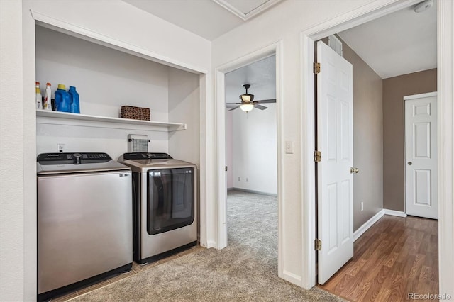 clothes washing area with wood finished floors, baseboards, washing machine and clothes dryer, laundry area, and carpet flooring