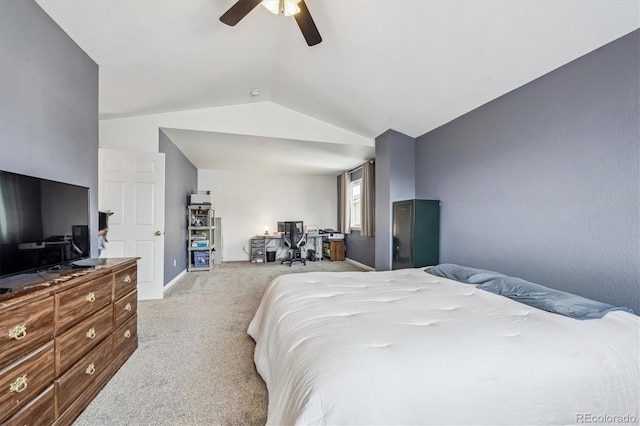 carpeted bedroom with ceiling fan and vaulted ceiling